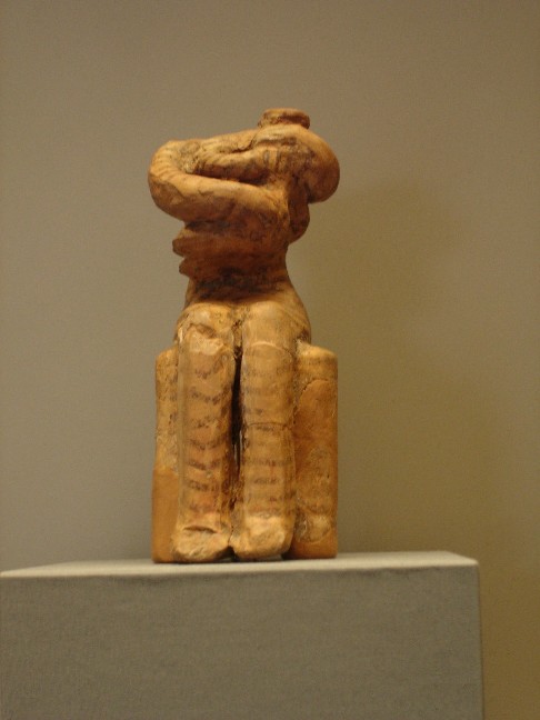 The Kourotrofos - Nurse.Clay figurine of a woman with a n infant in her arms.